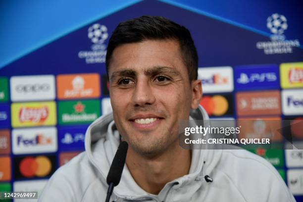 Manchester City's Spanish midfielder Rodri addresses a press conference at the Ramon Sanchez Pizjuan stadium in Seville on September 5 on the eve of...