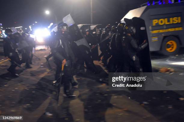 People clash with police officers during a demonstration after the government raised fuel prices in Makassar, South Sulawesi, Indonesia on September...