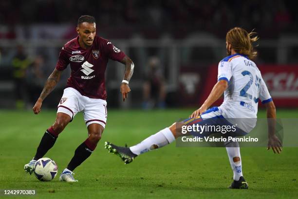 Valentino Lazaro of Torino FC in action against Antonino Gallo of US Lecce during the Serie A match between Torino FC and US Lecce at Stadio Olimpico...