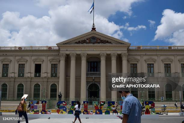 People walk by the National Palace on September 5, 2022 in San Salvador, El Salvador. On September 7, El Salvador commemorates it's first year with...