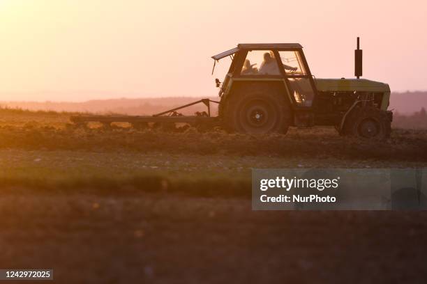 Farm tractor works on a field in Poland on September 5, 2022.