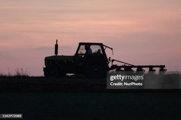 Farm tractor works on a field in Poland on September 5, 2022.