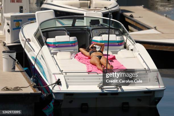 Los Angeles, CaliforniaSept 5, 2022Blanca Herrera, of Compton, CA, sunbaths on a boat in San Pedro, CA on Sept. 5, 2022. As the temperature remains...