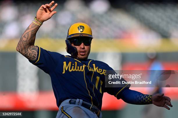 Kolten Wong of the Milwaukee Brewers advances to third base in the eighth inning against the Colorado Rockies at Coors Field on September 5, 2022 in...