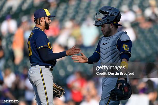 Devin Williams and Victor Caratini of the Milwaukee Brewers celebrate a 6-4 win against the Colorado Rockies at Coors Field on September 5, 2022 in...