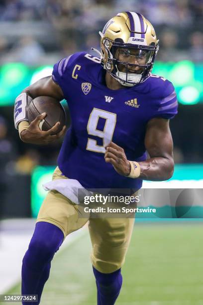 Washington Huskies quarterback Michael Penix Jr. Runs the ball during a college football game between the Kent State Golden Flashes and the...