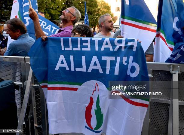 The logo of Italian far-right party Fratelli d'Italia is pictured during a rally to launch its leader's campaign for general elections, in Ancona,...