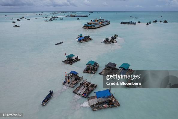 Mining Rafts Bamboo rafts and dredging ship used to dredge for tin ore in the ...