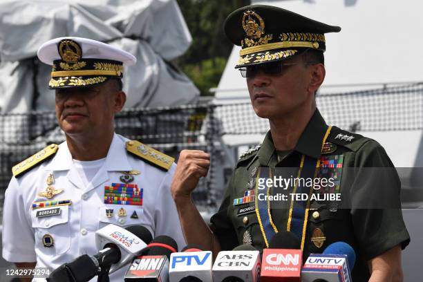Philippine military chief Lieutenant General Bartolome Bacarro speaks as Vice Admiral Adeluis Bordado looks on following the inauguration ceremony of...