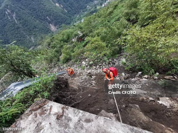 Rescuers search for victims on a mountain in Luding county, Ganzi prefecture, Southwest China's Sichuan province, Sept 6, 2022. The 6.8-magnitude...