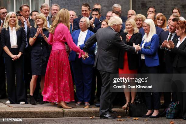 British Prime Minister Boris Johnson and his wife Carrie Johnson greet Conservative party members after delivering a farewell address before his...