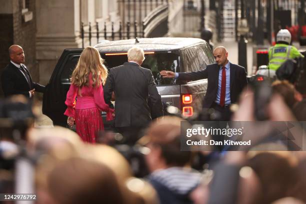 British Prime Minister Boris Johnson and his wife Carrie Johnson depart after his farewell address before his official resignation at Downing Street...