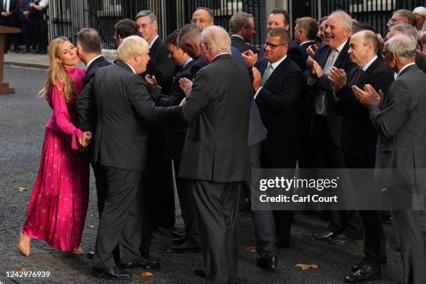 British Caretaker Prime Minister Boris Johnson and wife Carrie depart after his farewell address before his official resignation at Downing Street on...