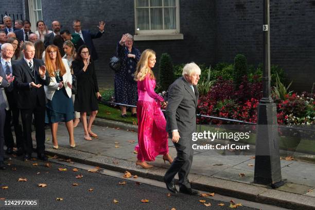 British Caretaker Prime Minister Boris Johnson and wife Carrie depart after his farewell address before his official resignation at Downing Street on...