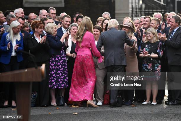 British Prime Minister Boris Johnson and his wife Carrie Johnson greet Conservative party members after his farewell address before his official...