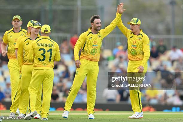 Australia's Glenn Maxwell celebrates his wicket of New Zealand's Kane Williamson during the first one-day international cricket match between...