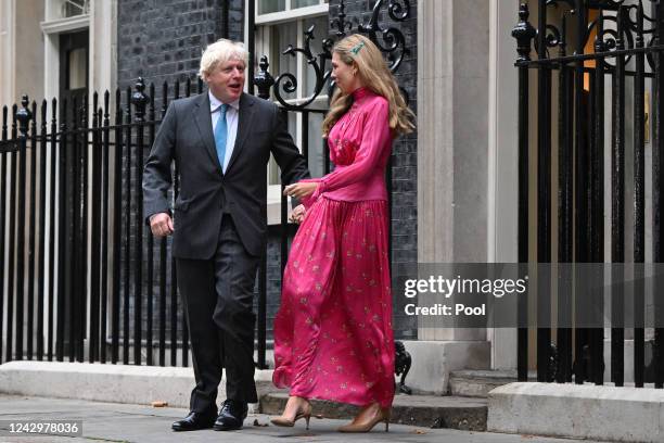 British Prime Minister Boris Johnson arrives with his wife Carrie Johnson as he prepares to deliver a farewell address before his official...