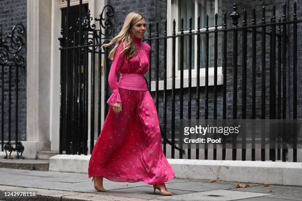 British Prime Minister Boris Johnson's wife Carrie Johnson walks to join Conservative party members as he prepares to deliver a farewell address...
