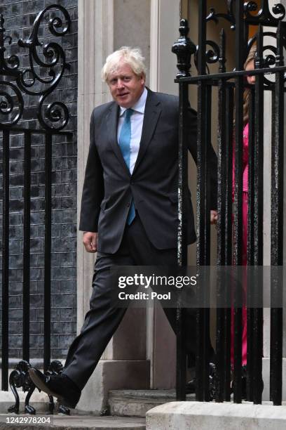 British Prime Minister Boris Johnson arrives with his wife Carrie Johnson as he prepares to deliver a farewell address before his official...