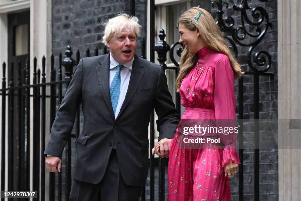 British Prime Minister Boris Johnson arrives with his wife Carrie Johnson as he prepares to deliver a farewell address before his official...