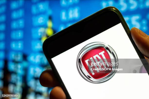 In this photo illustration, the Italian automobile manufacturer Fiat logo is displayed on a smartphone screen.