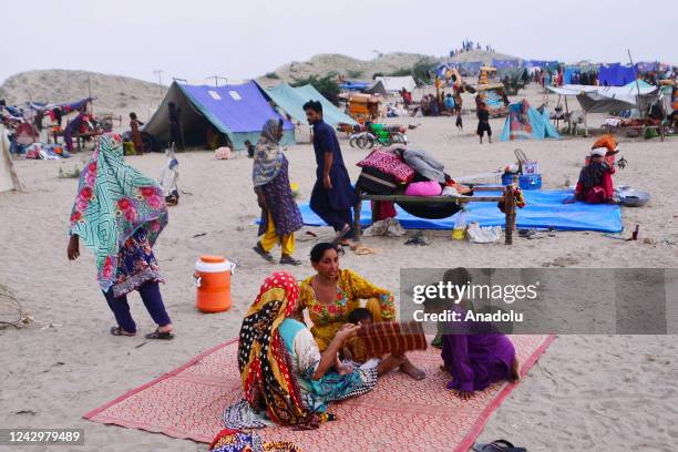 Displaced people take shelter at a makeshift camp in Sewan Sharif, southern Sindh province, Pakistan on September 06, 2022. Monsoon rains and melting...