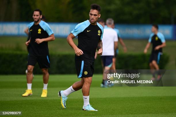 Inter Milan's Argentinian forward Lautaro Martinez warms up during a training session in Appiano Gentile, on the eve of the UEFA Champions League...