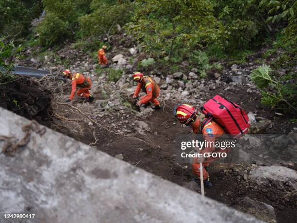 Rescuers search for victims on a mountain in Luding county, Ganzi prefecture, Southwest China's Sichuan province, Sept 6, 2022. The 6.8-magnitude...