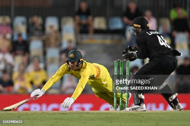 Australia's Alex Carey completes a run during the first one-day international cricket match between Australia and New Zealand at the Cazalys Stadium...