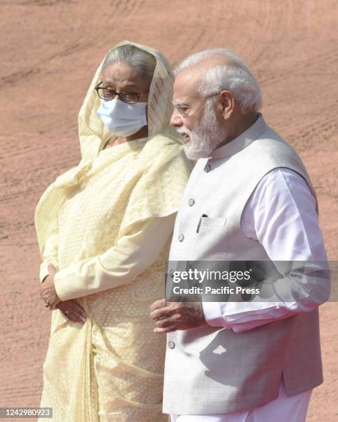 Prime Minister Narendra Modi with Bangladesh counterpart Sheikh Hasina wearing face mask during a ceremonial reception in the forecourt of...