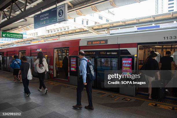 People seen walking on the platform after the Skytrain arrived at BTS Sala Daeng in Bangkok.