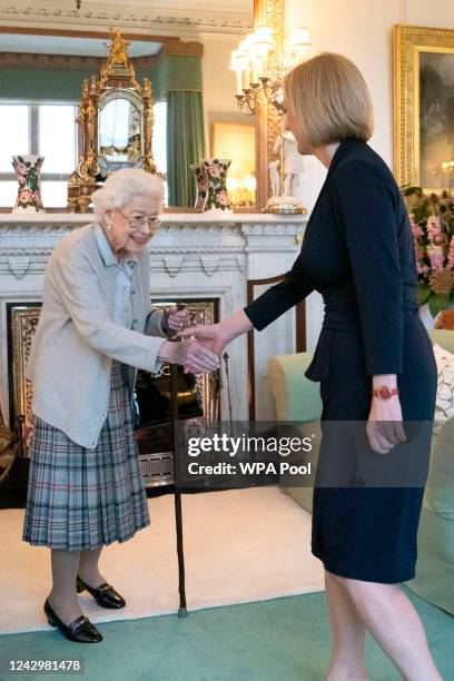 Queen Elizabeth greets newly elected leader of the Conservative party Liz Truss as she arrives at Balmoral Castle for an audience where she will be...