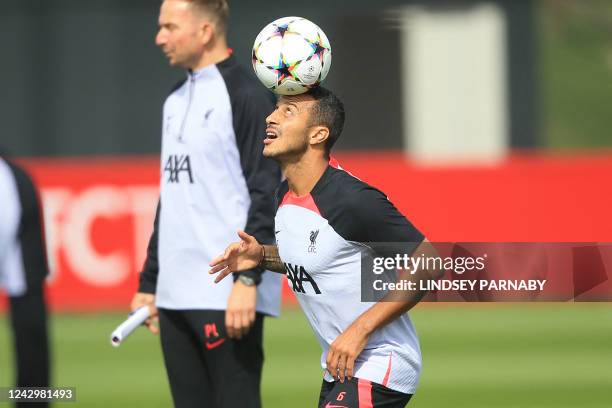 Liverpool's Spanish midfielder Thiago Alcantara takes part in a training session at Liverpool training ground in Liverpool, northwest England, on...