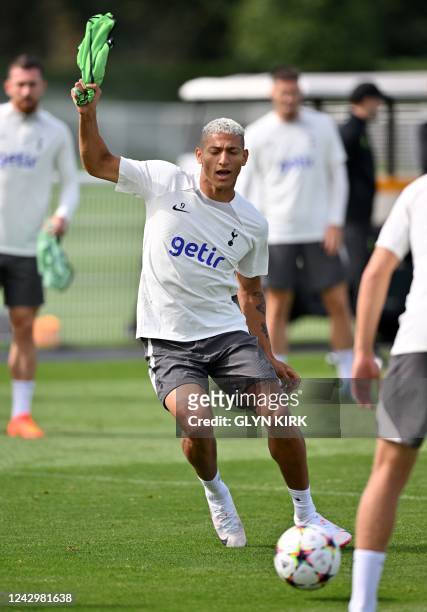 Tottenham Hotspur's Brazilian striker Richarlison takes part in a team training session at Tottenham Hotspur Football Club Training Ground in north...