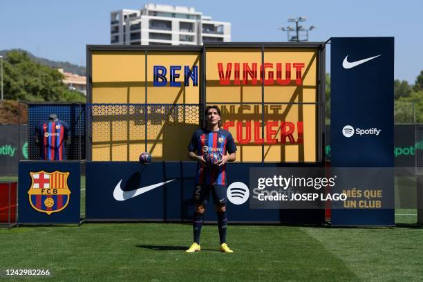 Barcelona's Spanish defender Hector Bellerin poses for a photograph during his official presentation at the Ciudad Deportiva near Barcelona on...