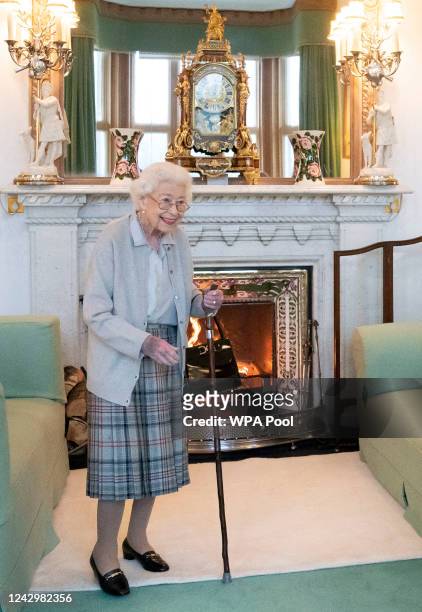 Queen Elizabeth II waits in the Drawing Room before receiving newly elected leader of the Conservative party Liz Truss at Balmoral Castle for an...