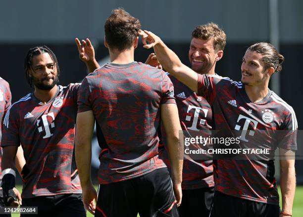 Bayern Munich's German midfielder Serge Gnabry, Bayern Munich's German midfielder Leon Goretzka, Bayern Munich's german forward Thomas Mueller and...