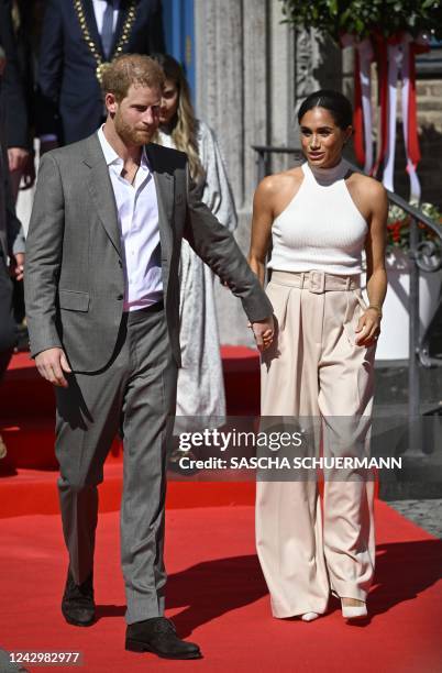 Meghan, Duchess of Sussex and Prince Harry, Duke of Sussex leave the city hall in Duesseldorf, western Germany, on September 6, 2022 after attending...