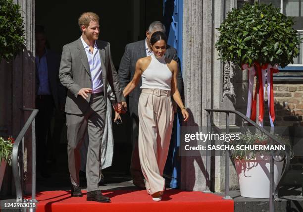 Meghan, Duchess of Sussex and Prince Harry, Duke of Sussex leave the city hall in Duesseldorf, western Germany, on September 6, 2022 after attending...