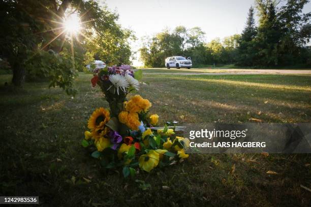 Flowers sit outside the house where one of the stabbing victims was found in Weldon, Saskatchewan, Canada, on September 6, 2022. - One of two...
