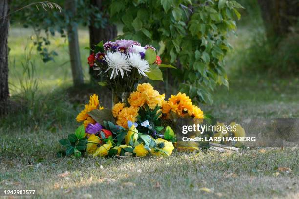 Flowers sit outside the house where one of the stabbing victims was found in Weldon, Saskatchewan, Canada, on September 6, 2022. - One of two...