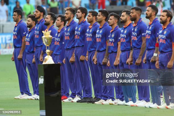 Indian players sing their national anthem before the start of the Asia Cup Twenty20 international cricket Super Four match between India and Sri...