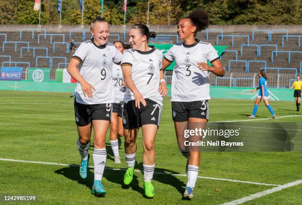 Leonie Schetter of Germany, Marina Scholz of Germany and Lisa Baum of Germany celebrates a goal scored by Marina Scholz of Germany 2-1 during a...