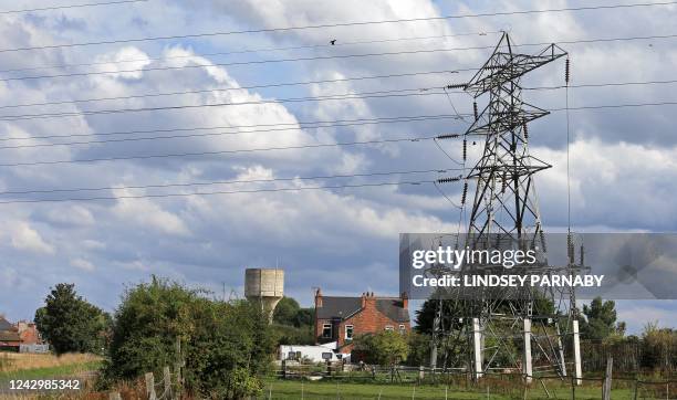 Electricity pylons hold power cables leading away from the SSE gas-fired Keadby Power Station near Scunthorpe in northern England on September 6,...