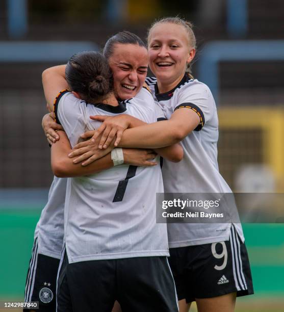 Sara Sahiti of Germany scores and celebrates with her teammates Marina Scholz of Germany and Leonie Schetter of Germany making the score 3-1 during a...