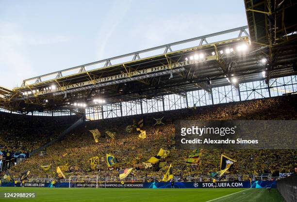 The fans of Borussia Dortmund in action prior to the Champions League match between Borussia Dortmund and FC Copenhagen at the Signal Iduna Park on...