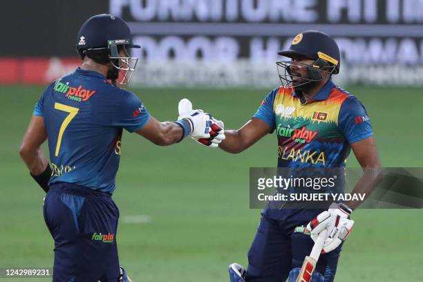 Sri Lanka's captain Dasun Shanaka and his teammate Bhanuka Rajapaksa after a shot during the Asia Cup Twenty20 international cricket Super Four match...