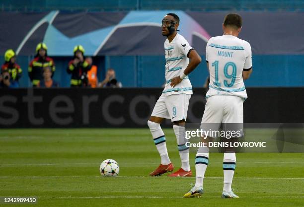 Chelsea's Gabon forward Pierre-Emerick Aubameyang takes a free kick as Chelsea's Englaish midfielder Mason Mount looks on during the UEFA Champions...