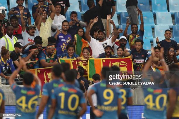 Sri Lanka's players greet their fans at the end of the Asia Cup Twenty20 international cricket Super Four match between India and Sri Lanka at the...
