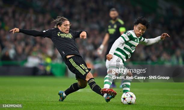 Celtic's Reo Hatate and Real Madrid's Luka Modric during a UEFA Champions League match between Celtic and Real Madrid at Celtic Park, on September 06...